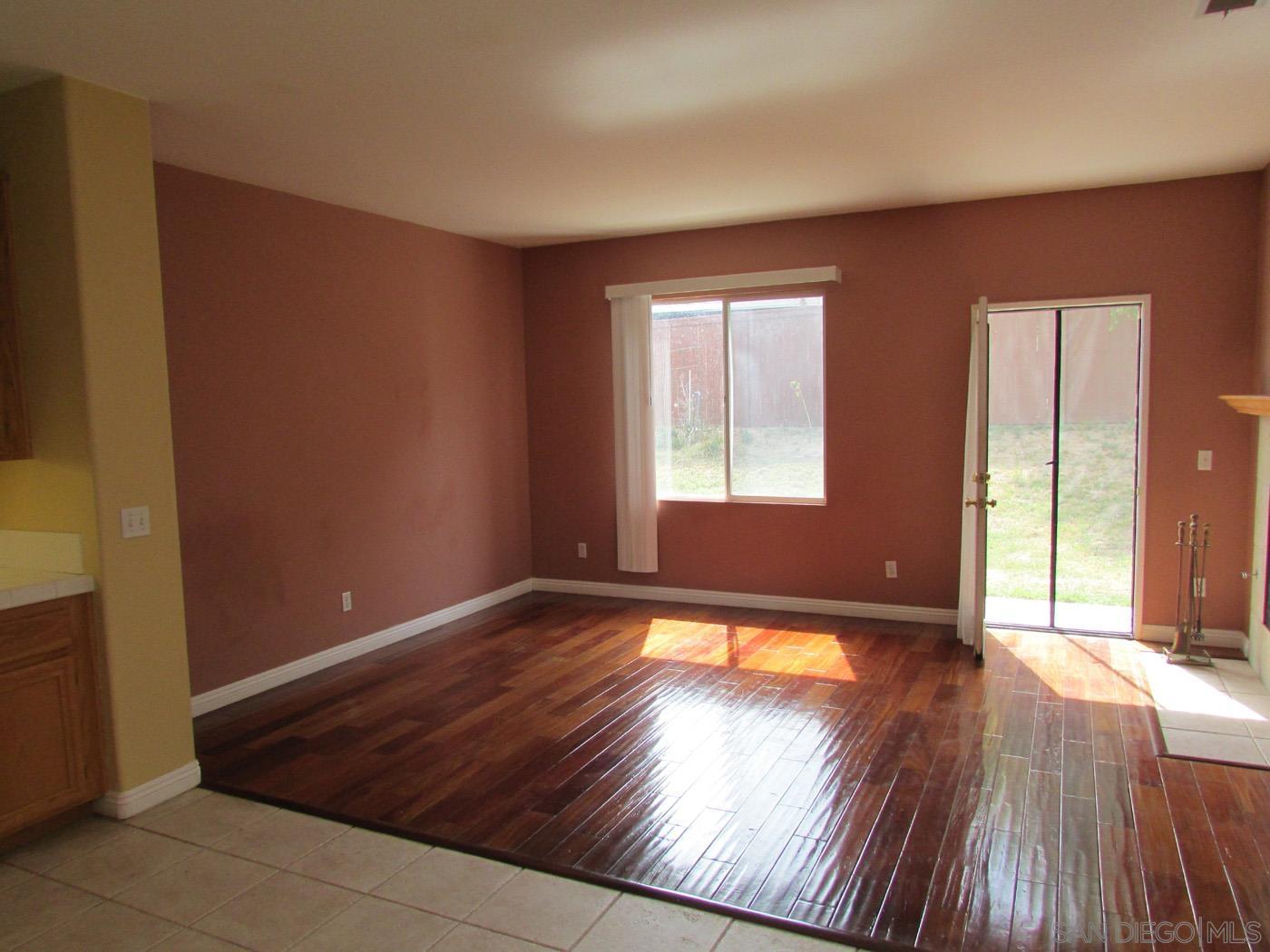757 Aldea Drive Oceanside, CA 92057 - Photo 5 of 11 a view of empty room with wooden floor and fan