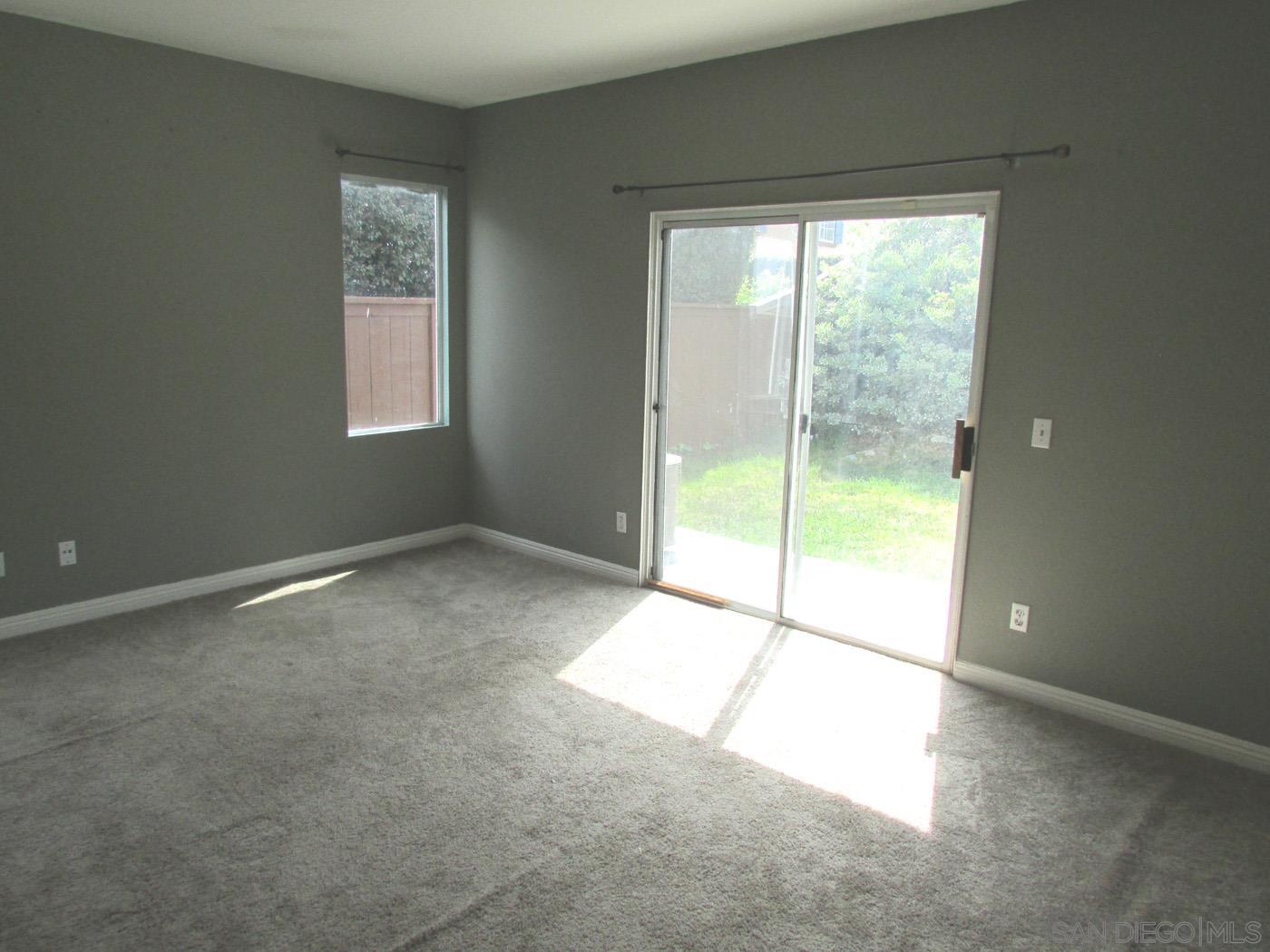757 Aldea Drive Oceanside, CA 92057 - Photo 7 of 11 a view of an empty room with a window