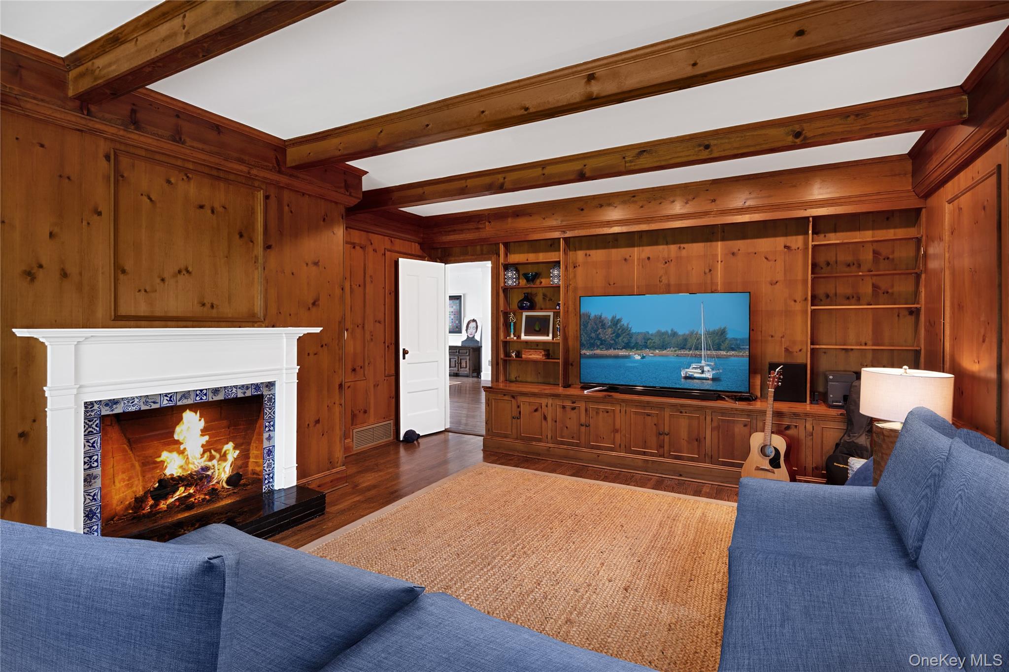 11 Bay Road Quogue, NY 11959 - Photo 12 of 41 a living room with furniture and a fireplace
