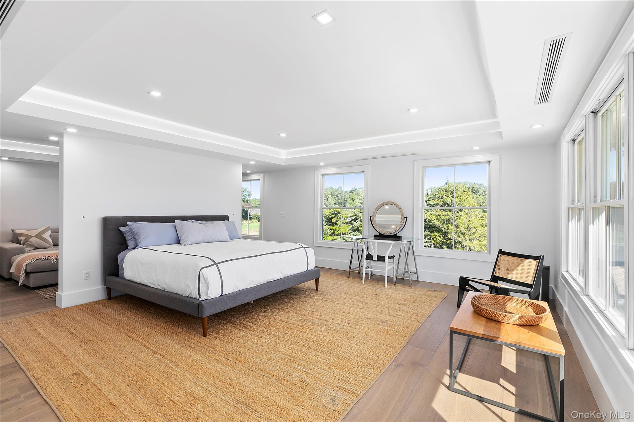 11 Bay Road Quogue, NY 11959 - Photo 16 of 41 a bedroom with a bed and large windows