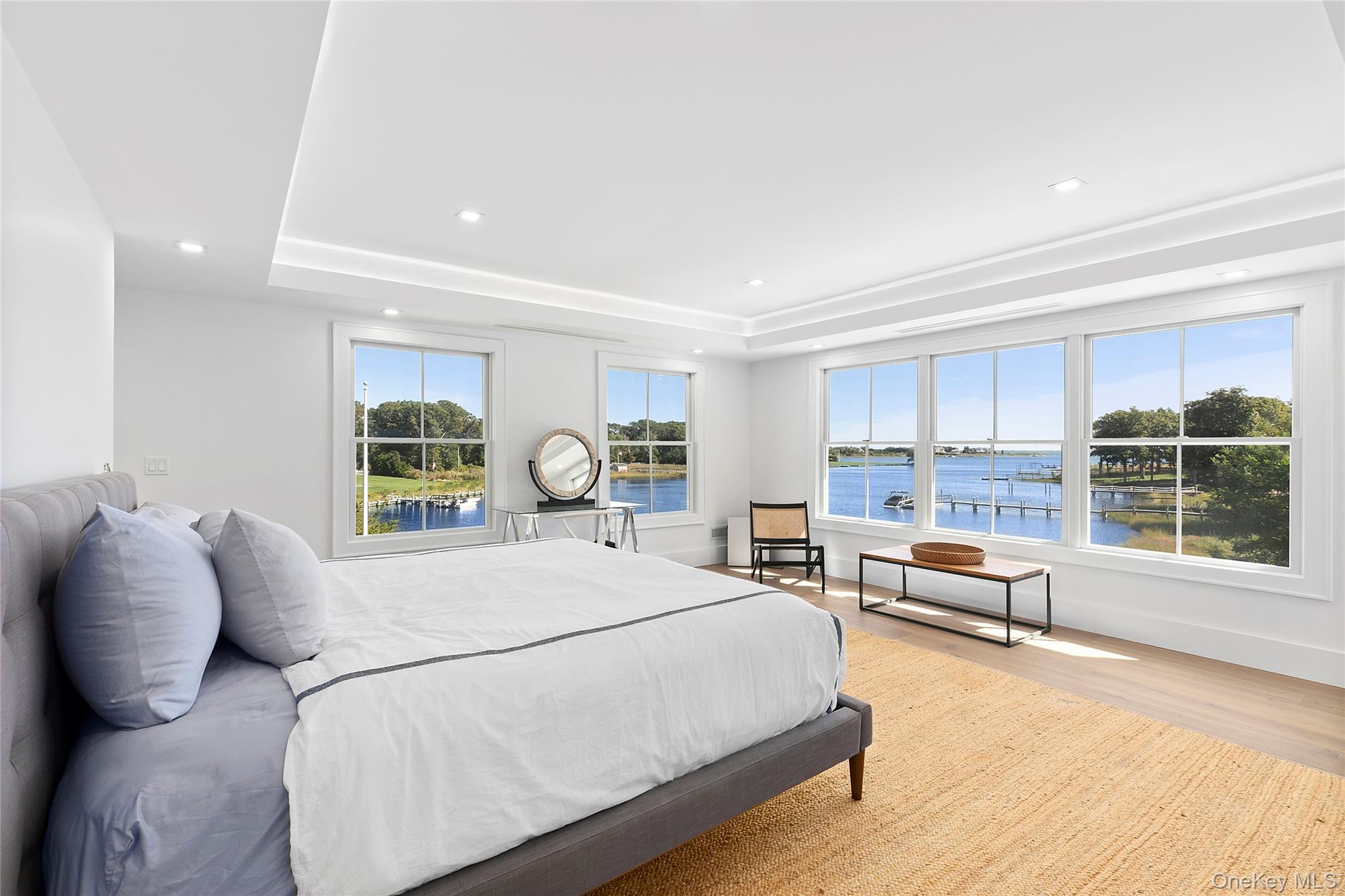 11 Bay Road Quogue, NY 11959 - Photo 17 of 41 a large bedroom with a large bed and a large window