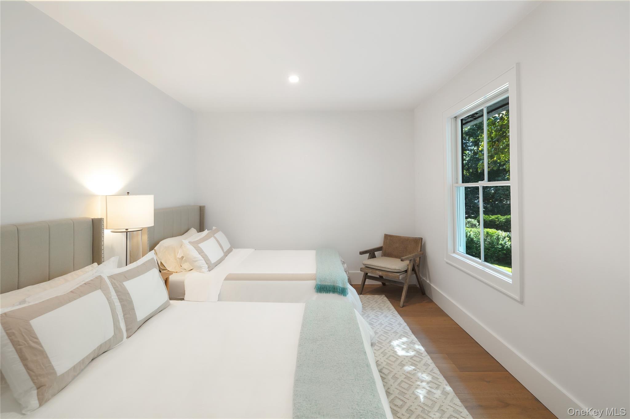 11 Bay Road Quogue, NY 11959 - Photo 19 of 41 a living room with furniture and a large window