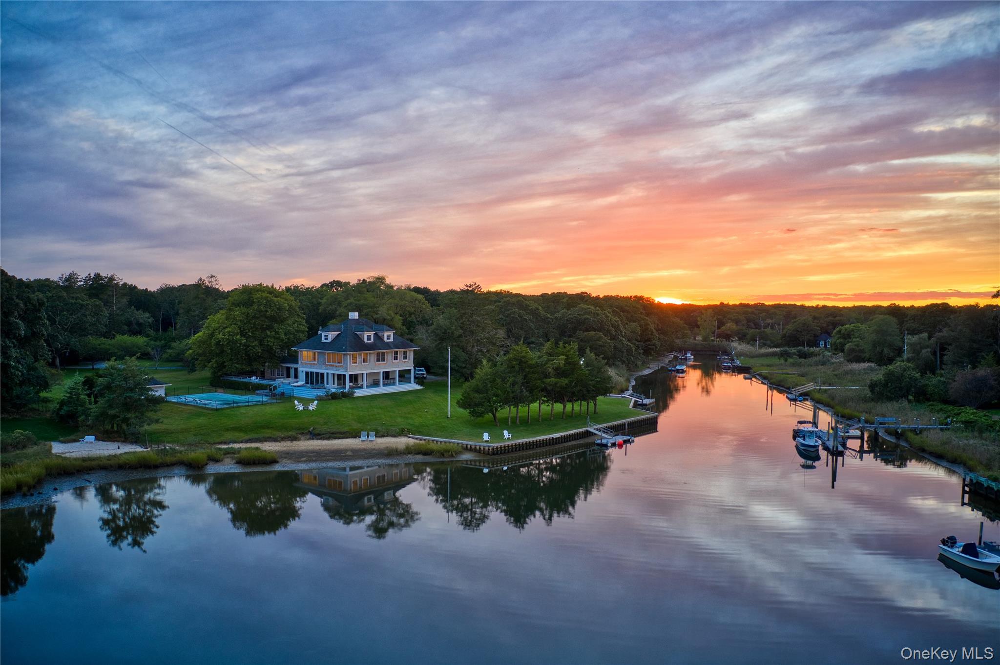 11 Bay Road Quogue, NY 11959 - Photo 2 of 41 a view of a lake with houses in the back