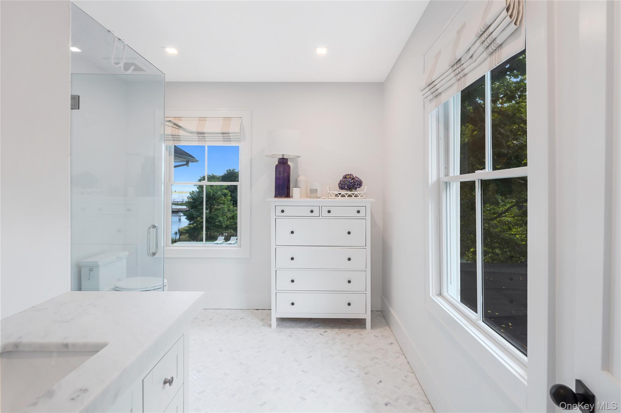 11 Bay Road Quogue, NY 11959 - Photo 22 of 41 a view of a bedroom with furniture and windows