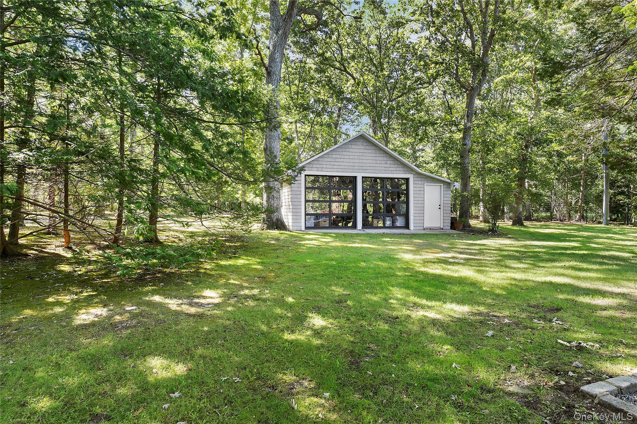 11 Bay Road Quogue, NY 11959 - Photo 29 of 41 a front view of a house with a yard
