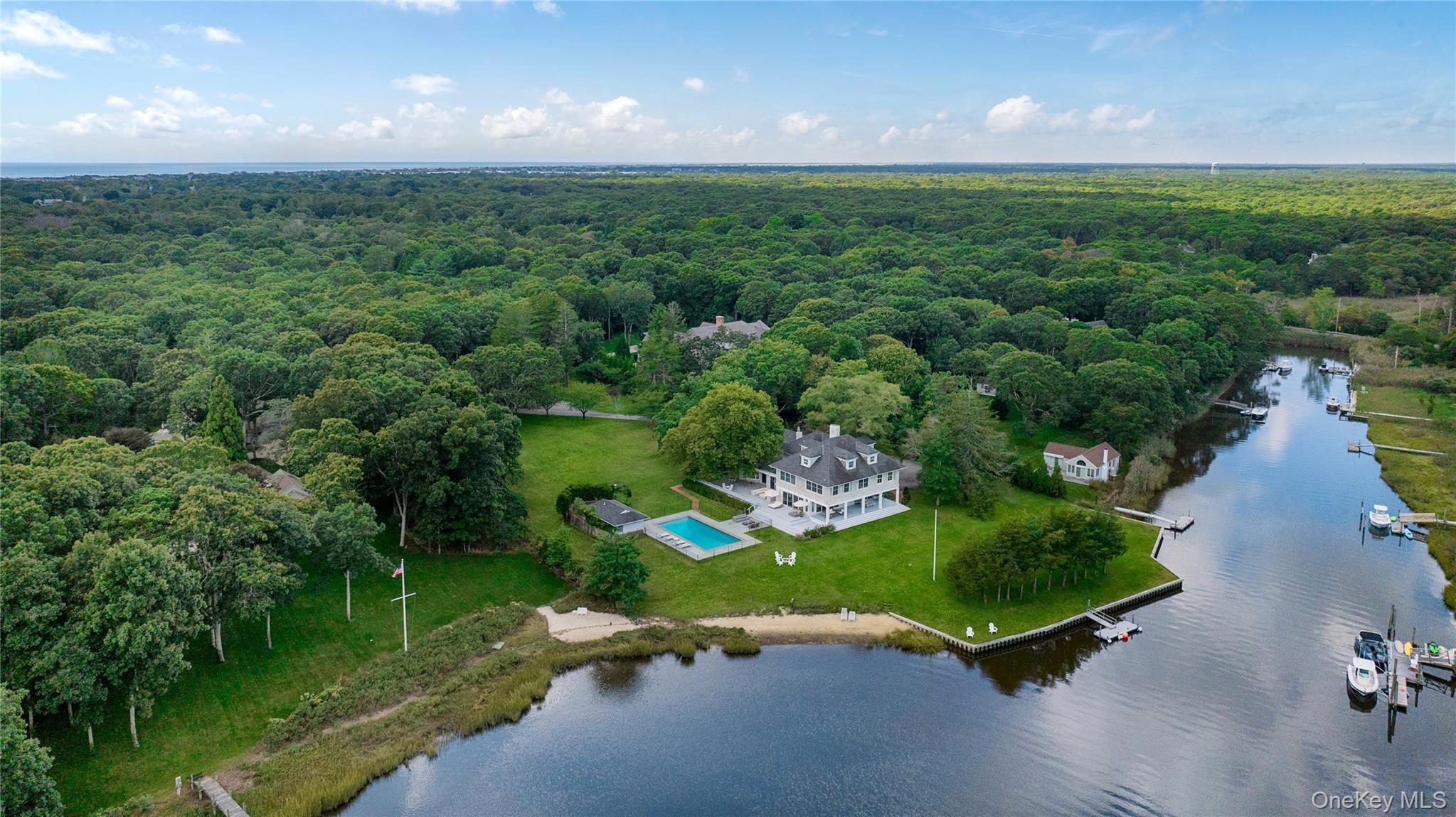 11 Bay Road Quogue, NY 11959 - Photo 32 of 41 an aerial view of a house with a yard and lake view