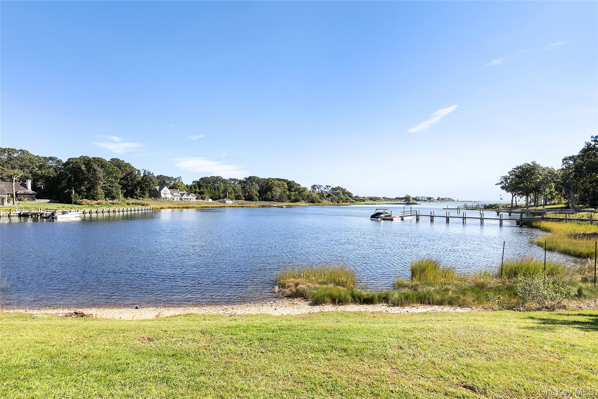 11 Bay Road Quogue, NY 11959 - Photo 36 of 41 a view of a lake with houses in the background