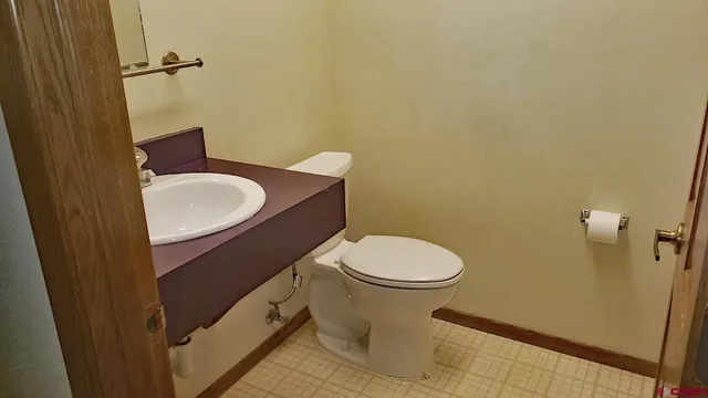 a bathroom with a toilet and a sink