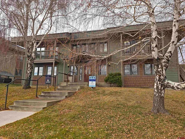 a view of a house with a snow on the road