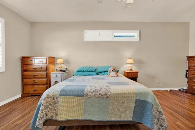 a view of a hallway with wooden floor and closet