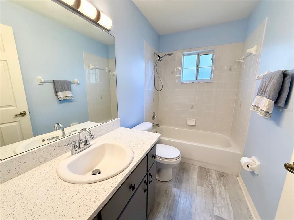 6008 Southwest 103rd Loop Ocala, FL 34476 - Photo 21 of 37 a bathroom with a sink a toilet and bathtub