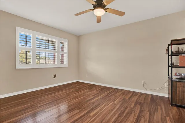 a bathroom with a sink a toilet a mirror and shower view
