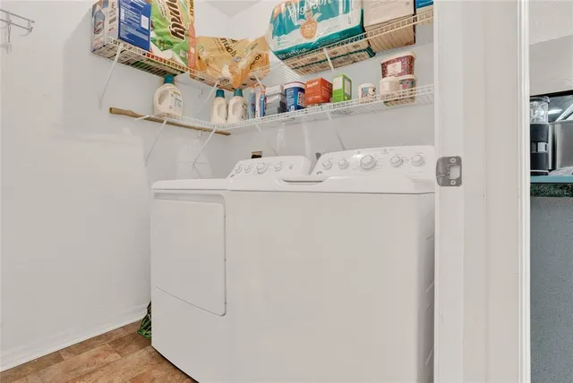 a view of swimming pool with yard and sitting area