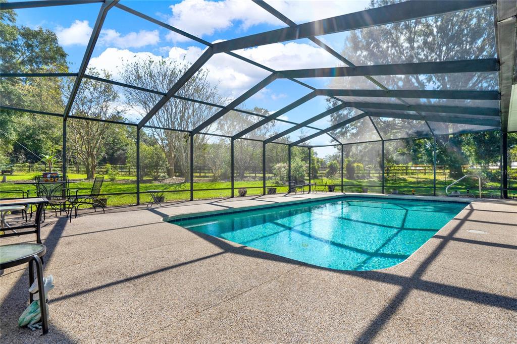 6008 Southwest 103rd Loop Ocala, FL 34476 - Photo 28 of 37 a view of swimming pool with yard and sitting area