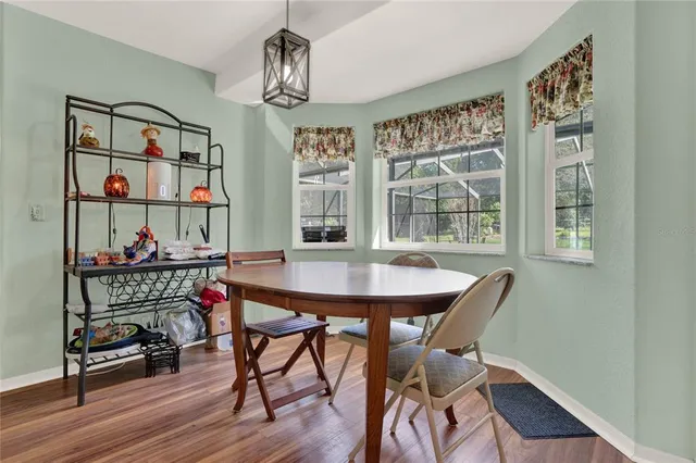 a kitchen with a sink a stove and cabinets