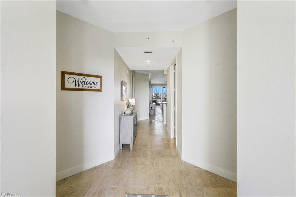 400 Flagship Drive, Unit 504 Naples, FL 34108 - Photo 20 of 38 Hallway with baseboards