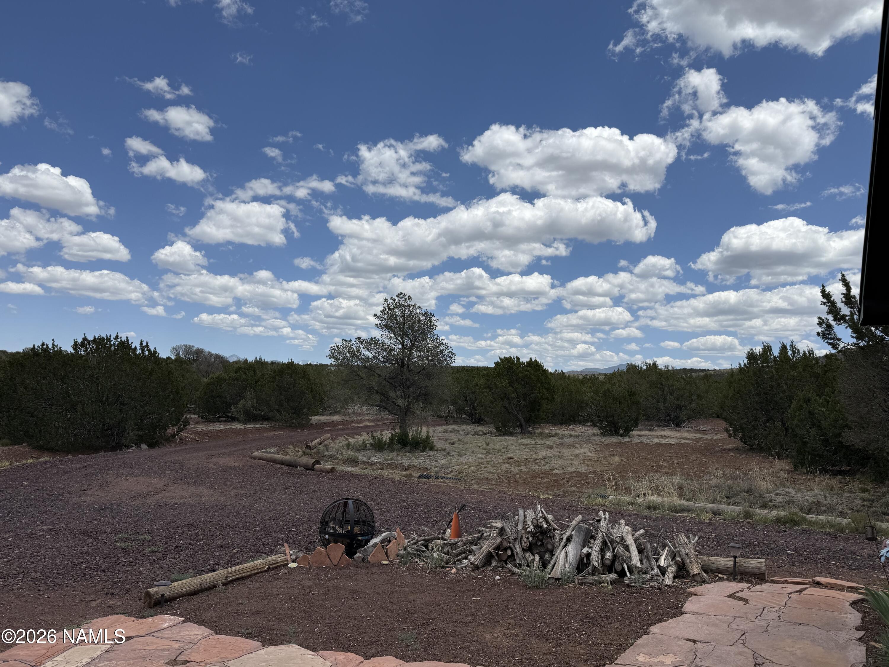 1431 East Cedar Road Williams, AZ 86046 - Photo 11 of 51 a view of a backyard with sitting area