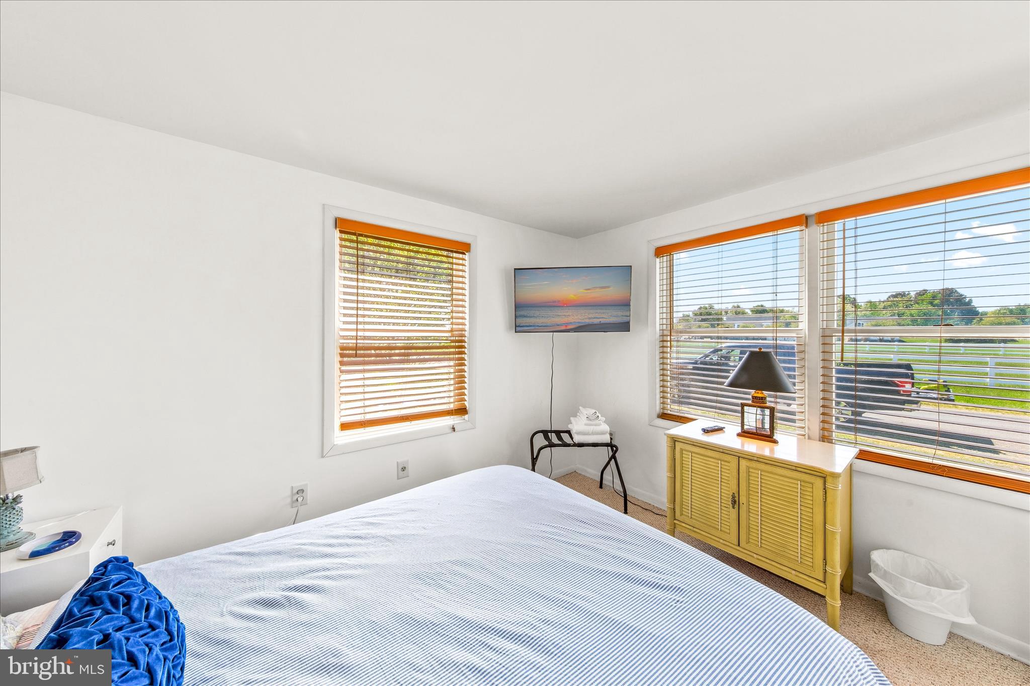 21406 Dogwood Cove Road Tilghman, MD 21671 - Photo 17 of 68 a bedroom with a bed and a large window
