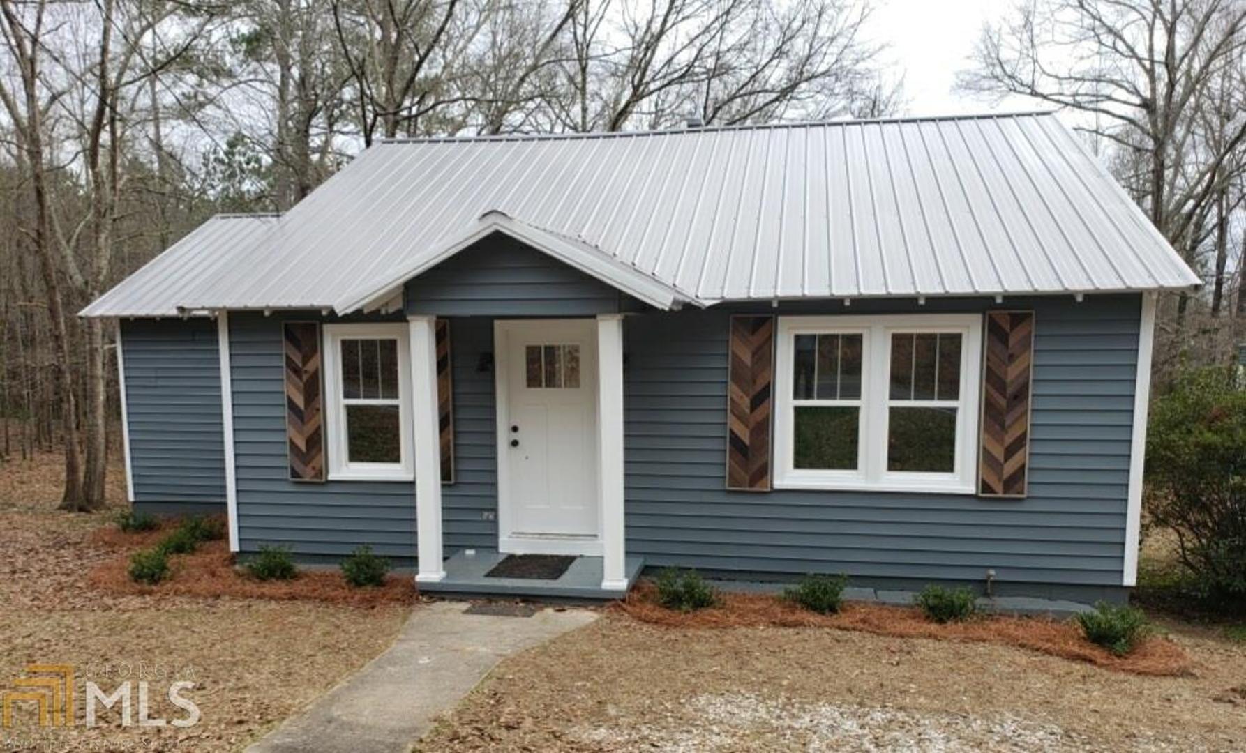 1566 River Road Valley, AL 36854 - Photo 1 of 1 Check out the new siding, new windows and new metal roof!