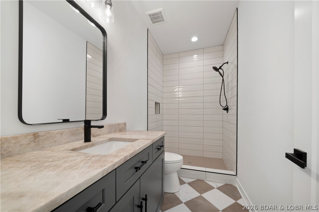 222 Red Bud Road Lake Ozark, MO 65049 - Photo 48 of 64 Beautifully finished bathroom with custom vanity a