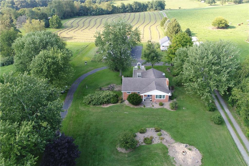 514 Pleasant Hill Road Hookstown, PA 15050 - Photo 1 of 25 a aerial view of a house with a yard and a large pool
