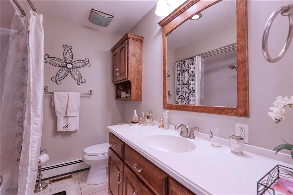 514 Pleasant Hill Road Hookstown, PA 15050 - Photo 12 of 25 a bathroom with a granite countertop sink a toilet and a mirror