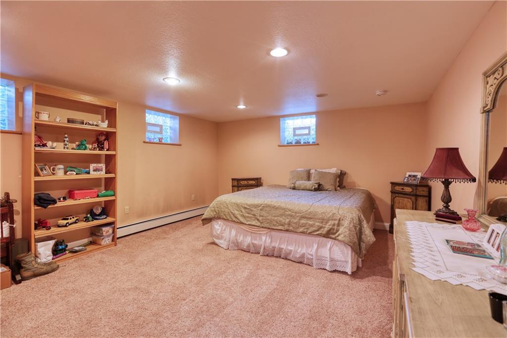 514 Pleasant Hill Road Hookstown, PA 15050 - Photo 17 of 25 a spacious bedroom with a bed and a cabinets