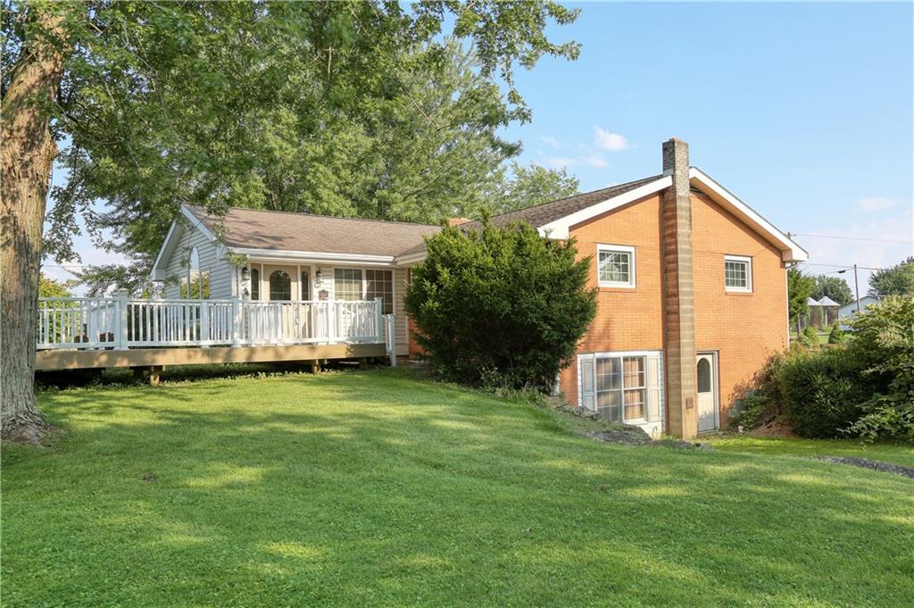 514 Pleasant Hill Road Hookstown, PA 15050 - Photo 20 of 25 a front view of a house with a garden
