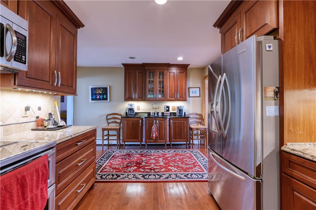 514 Pleasant Hill Road Hookstown, PA 15050 - Photo 7 of 25 a kitchen with stainless steel appliances granite countertop a refrigerator stove and sink