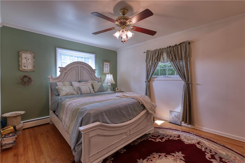 514 Pleasant Hill Road Hookstown, PA 15050 - Photo 8 of 25 a bedroom with a bed and a chandelier