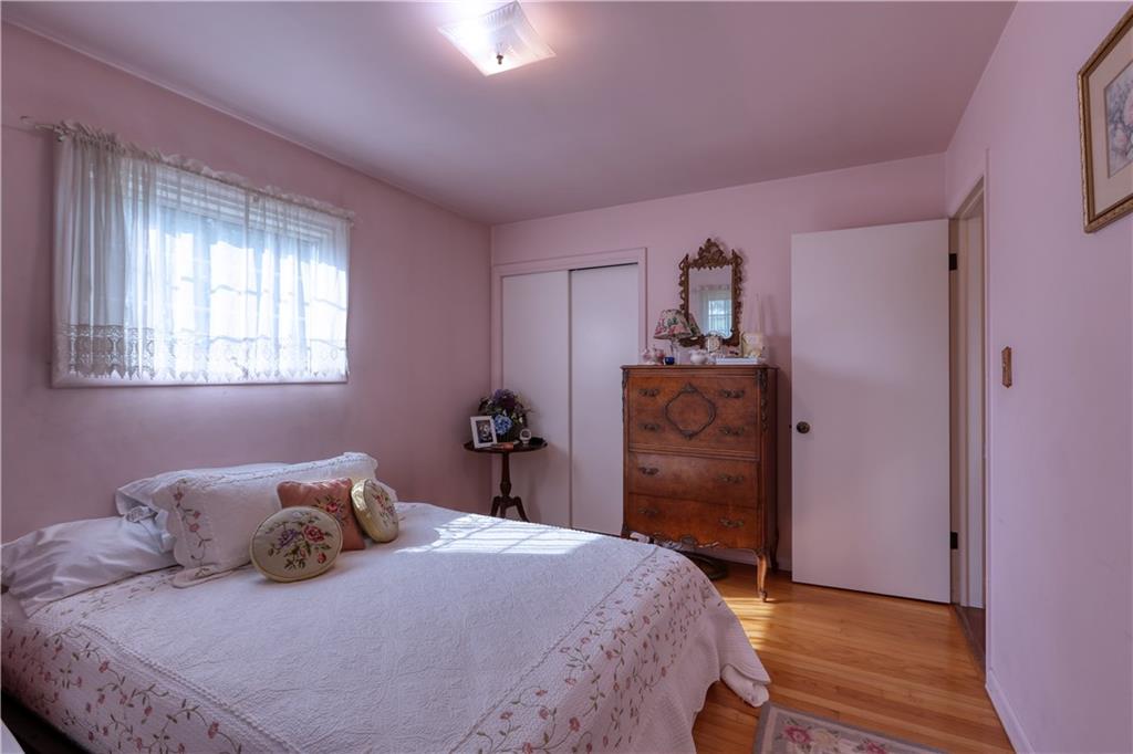 514 Pleasant Hill Road Hookstown, PA 15050 - Photo 10 of 25 a bedroom with a bed and wooden floor
