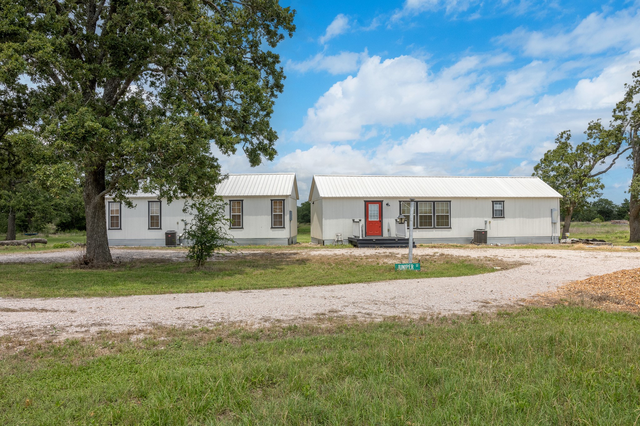 0 Goehring Road Ledbetter, TX 78946 - Photo 25 of 27 a front view of a house with a garden and plants