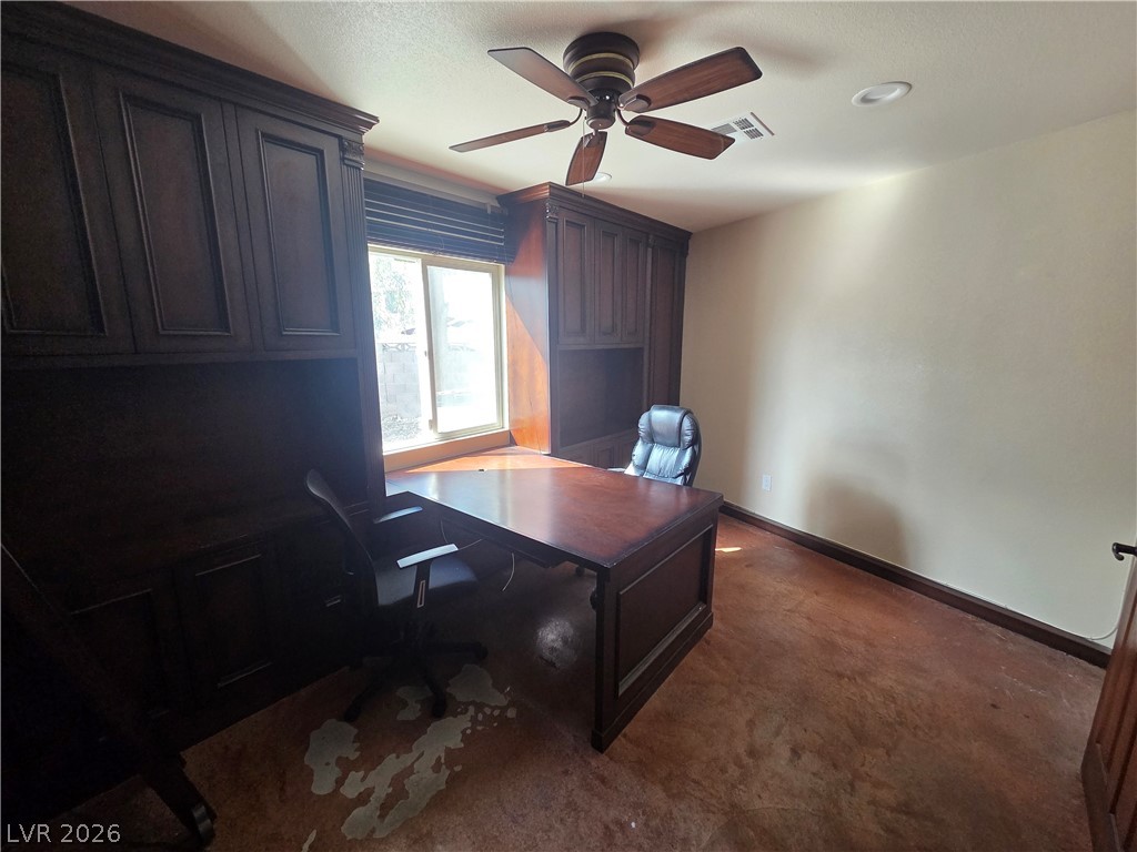 3381 Westwind Road Las Vegas, NV 89146 - Photo 36 of 52 A well-appointed office with built-in cabinetry and warm, inviting floors.