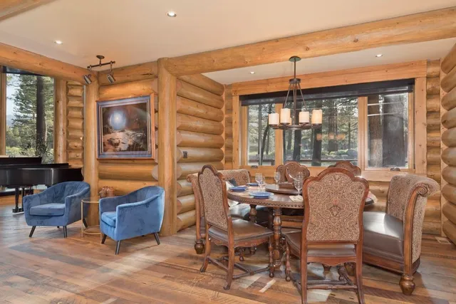 a bedroom with a bed and a flat tv screen on the dresser