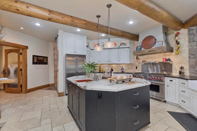 a bathroom with a granite countertop toilet sink and mirror