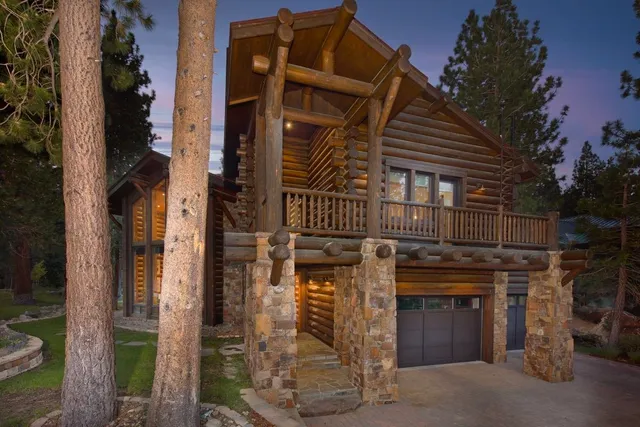 a view of a patio with table and chairs with wooden fence and plants