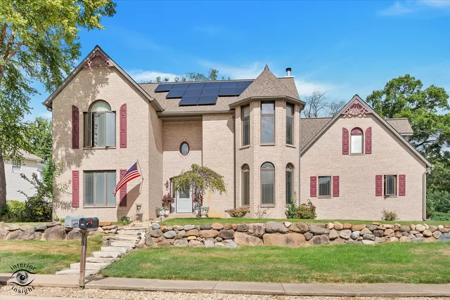 a front view of a house with garden