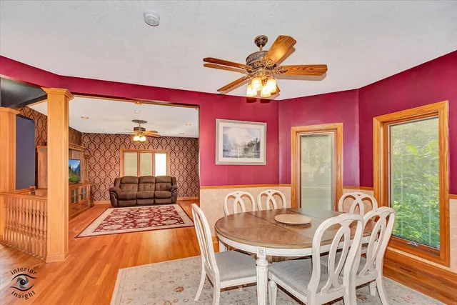 a dining room with furniture and window