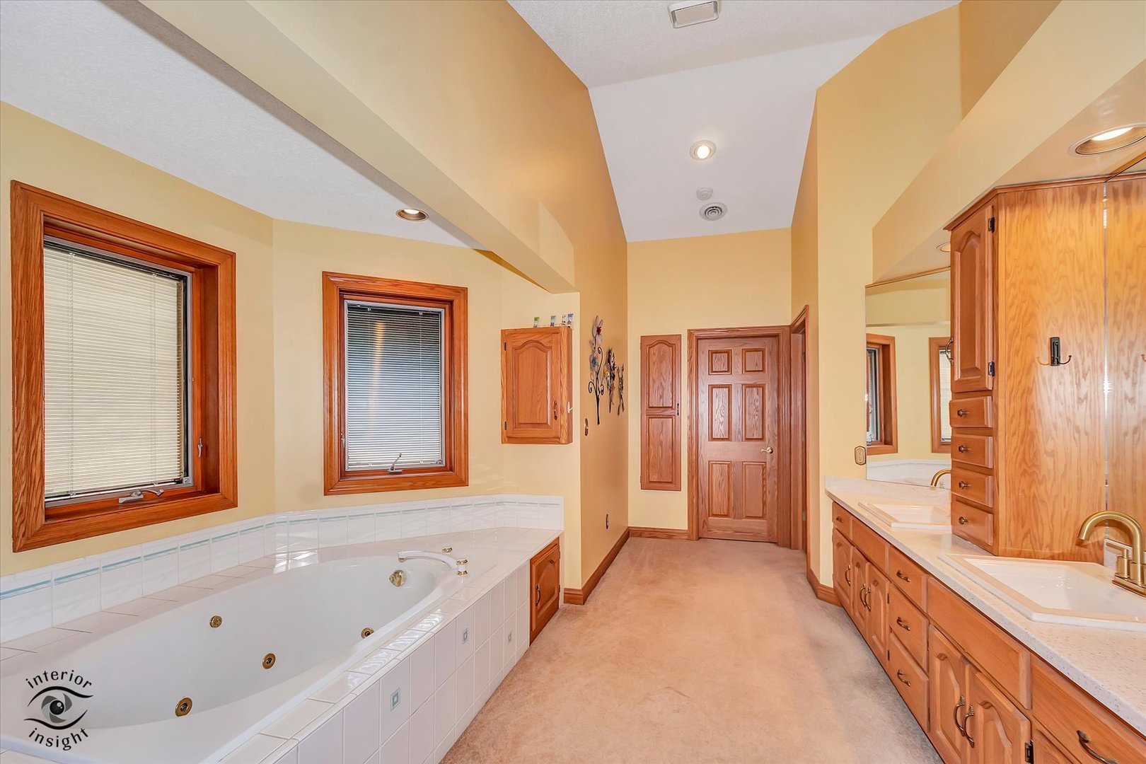 2500 Beverly Way Ottawa, IL 61350 - Photo 35 of 42 a bathroom with a tub a double vanity sink and mirror