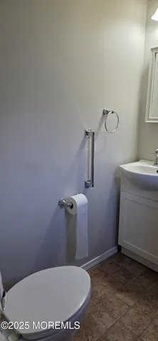 a bathroom with a toilet and a sink