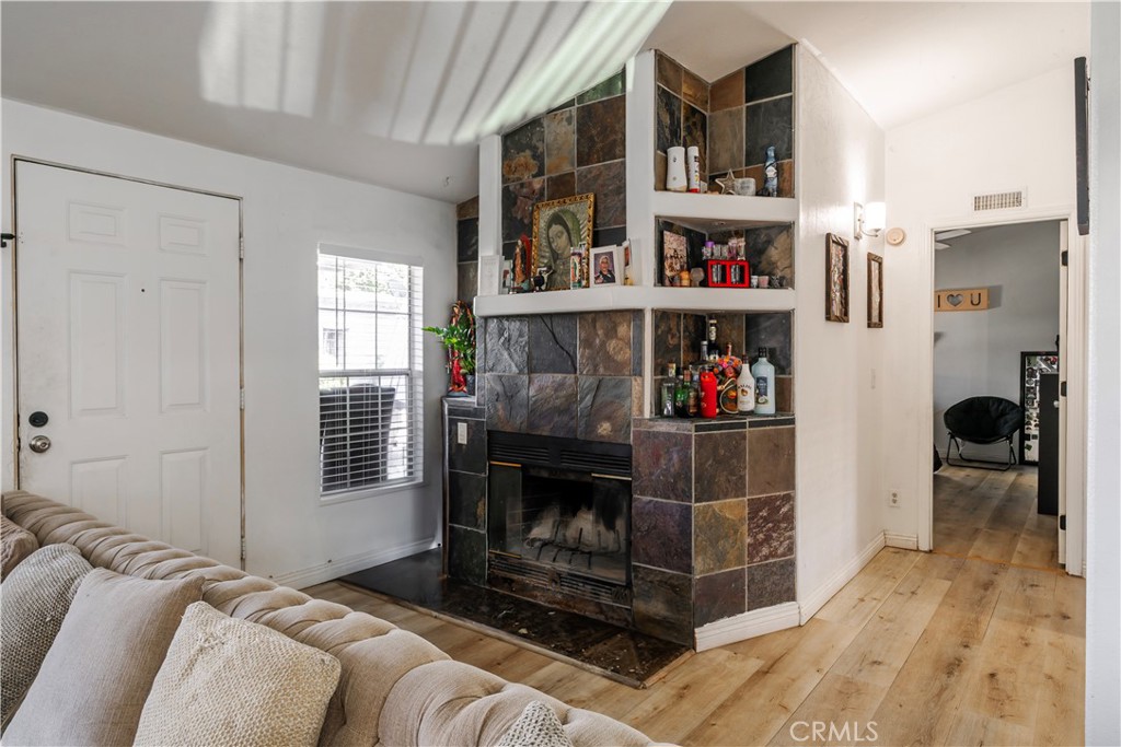 10350 Base Line Road, Unit 192 Rancho Cucamonga, CA 91701 - Photo 14 of 35 a living room with furniture a rug and a window