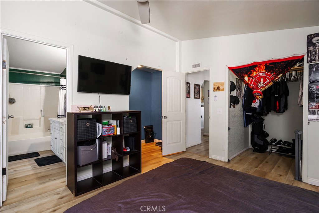 10350 Base Line Road, Unit 192 Rancho Cucamonga, CA 91701 - Photo 22 of 35 a view of a livingroom with workspace and a flat screen tv