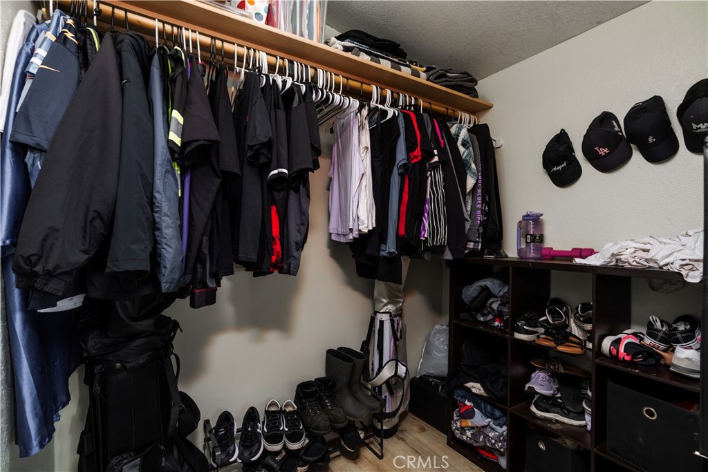 10350 Base Line Road, Unit 192 Rancho Cucamonga, CA 91701 - Photo 24 of 35 a view of walk in closet with clothes and shoes