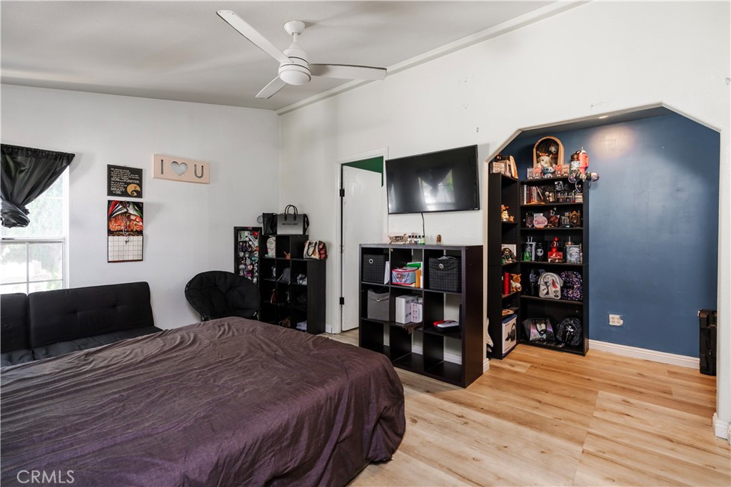 10350 Base Line Road, Unit 192 Rancho Cucamonga, CA 91701 - Photo 25 of 35 a bedroom with a bed a dresser and a book shelf