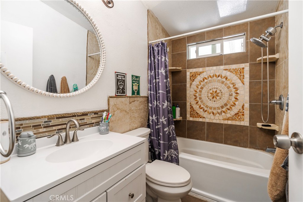 10350 Base Line Road, Unit 192 Rancho Cucamonga, CA 91701 - Photo 26 of 35 a bathroom with a sink a toilet and shower