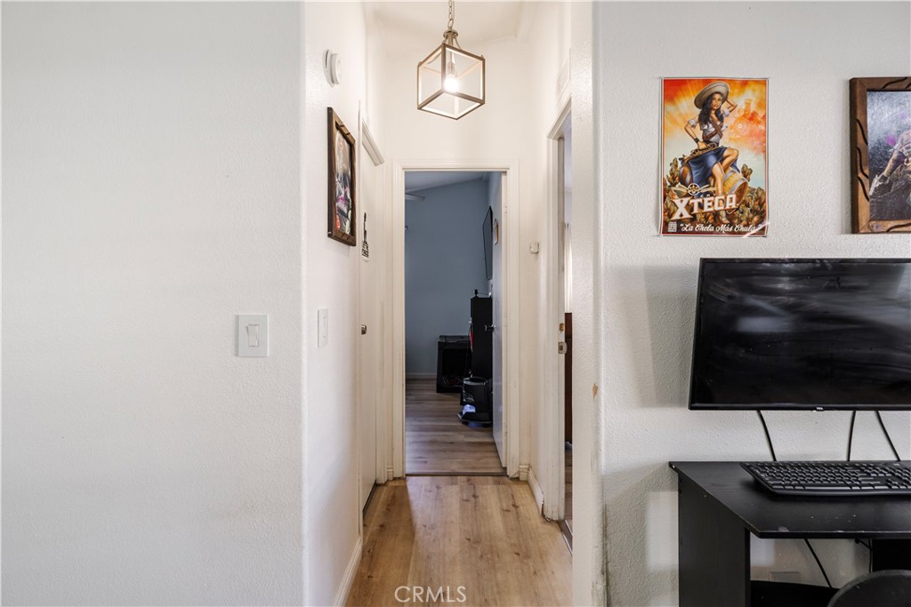 10350 Base Line Road, Unit 192 Rancho Cucamonga, CA 91701 - Photo 27 of 35 a view of a hallway with wooden floor and furniture