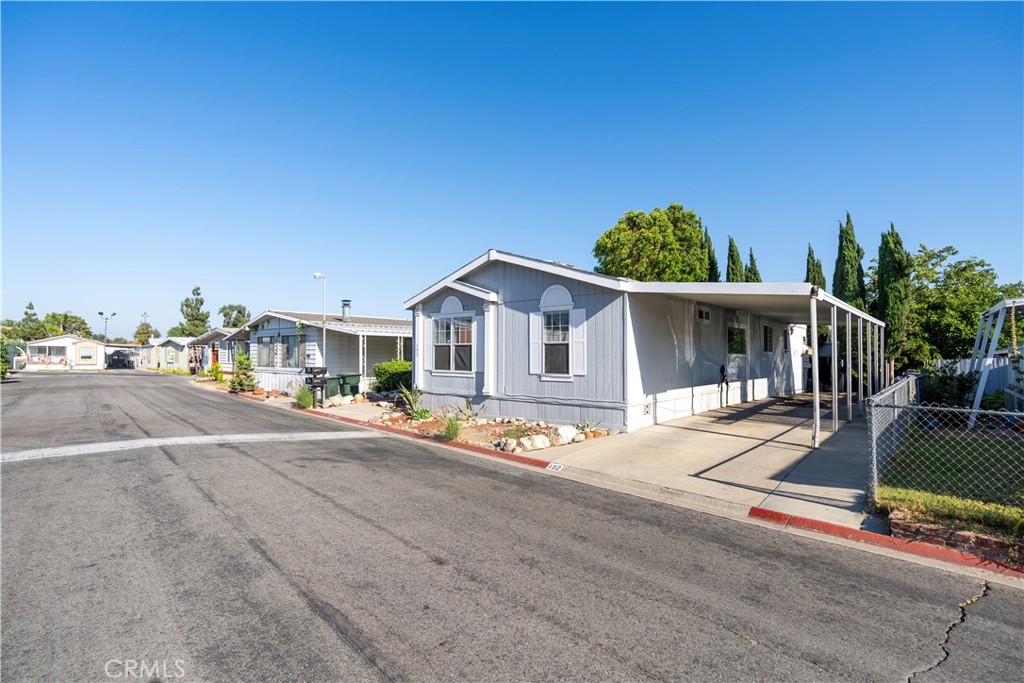 10350 Base Line Road, Unit 192 Rancho Cucamonga, CA 91701 - Photo 3 of 35 a view of a house with outdoor space and porch
