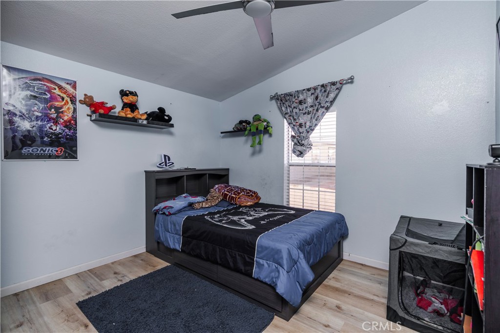 10350 Base Line Road, Unit 192 Rancho Cucamonga, CA 91701 - Photo 31 of 35 a bedroom with a bed and a window