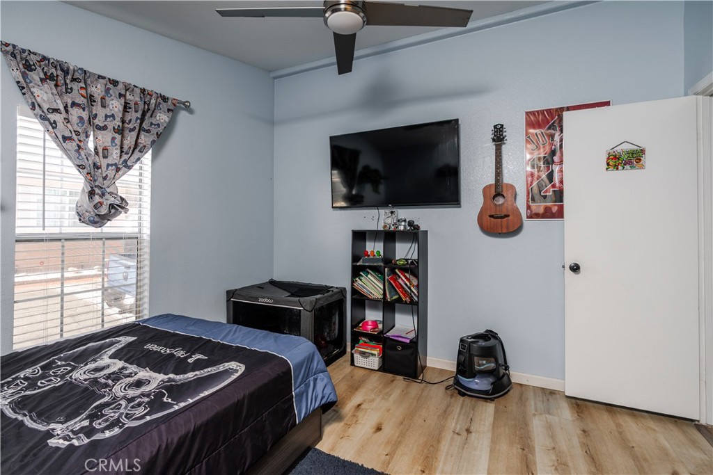 10350 Base Line Road, Unit 192 Rancho Cucamonga, CA 91701 - Photo 32 of 35 a bedroom with a bed and a flat screen tv