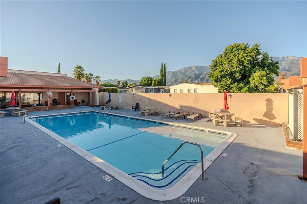 10350 Base Line Road, Unit 192 Rancho Cucamonga, CA 91701 - Photo 34 of 35 a view of a swimming pool and a chairs